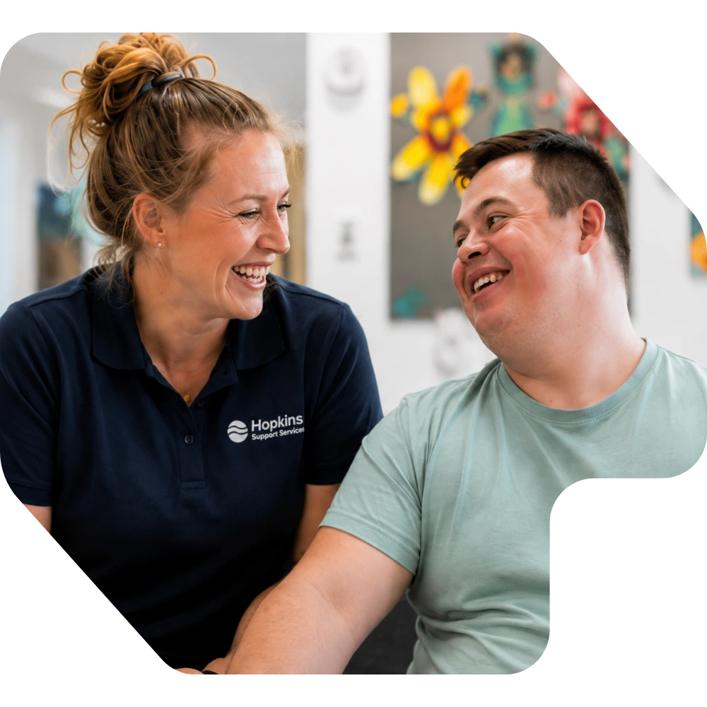 Support worker and man smiling