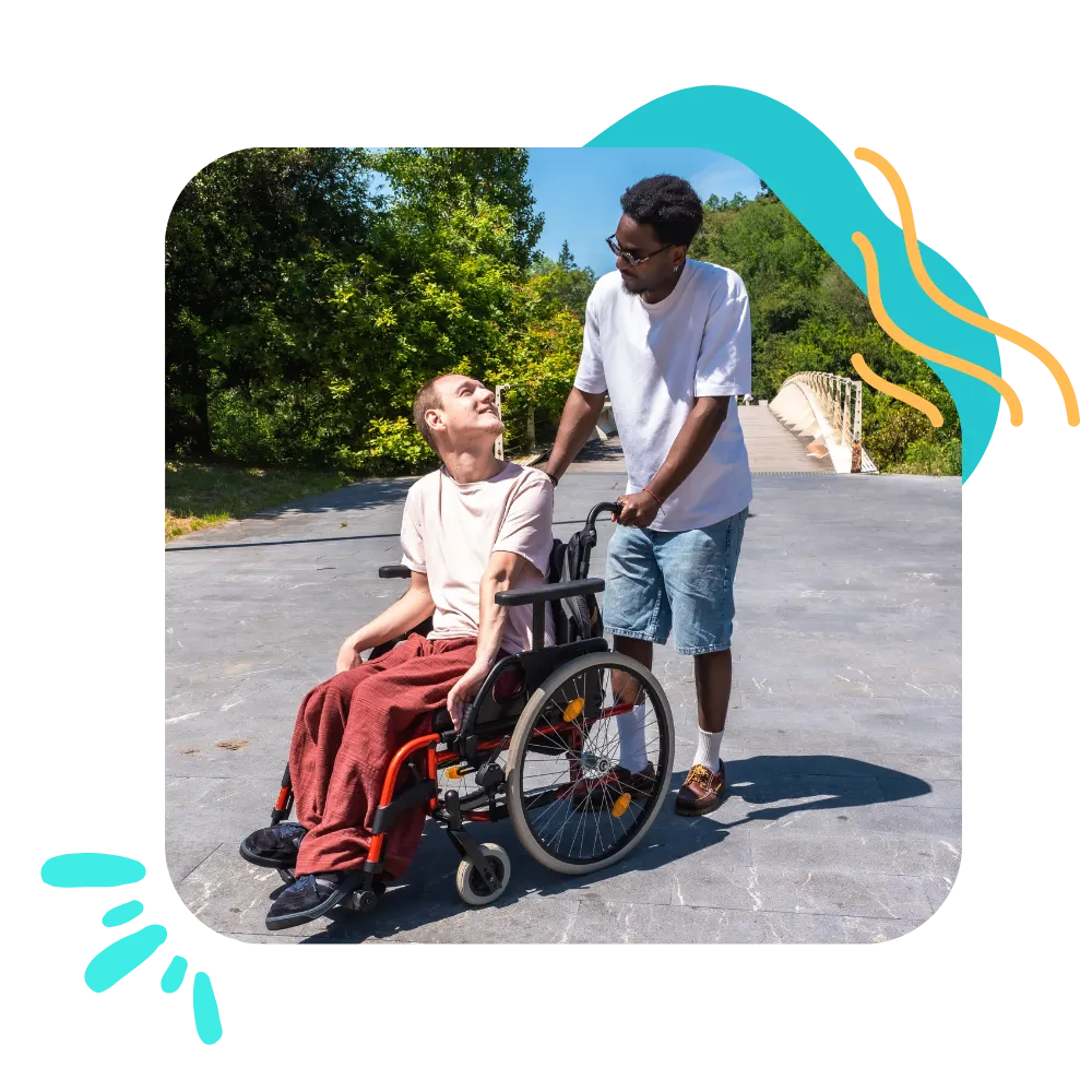 Disabled man in wheelchair with support worker